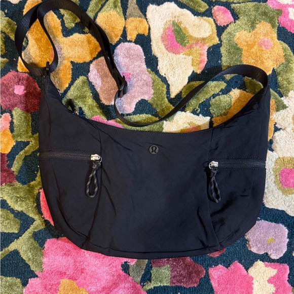 lululemon athletica Handbags - Lululemon Slouchy Sling Bag 6L in Black
